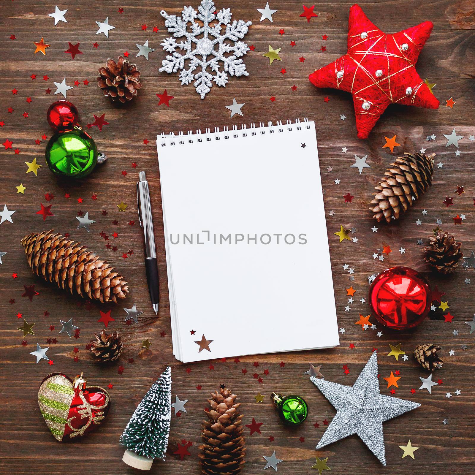 Christmas and New Year background with notepad, pen and decorati by aksenovko