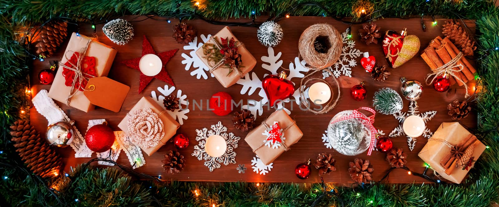 Christmas and New year background with presents, lights, candles and different decorations.