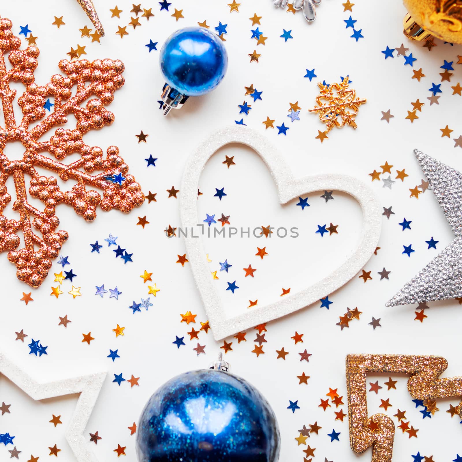 Christmas and New Year background with decorations - shiny stars, heart, balls, snowflakes and confetti.