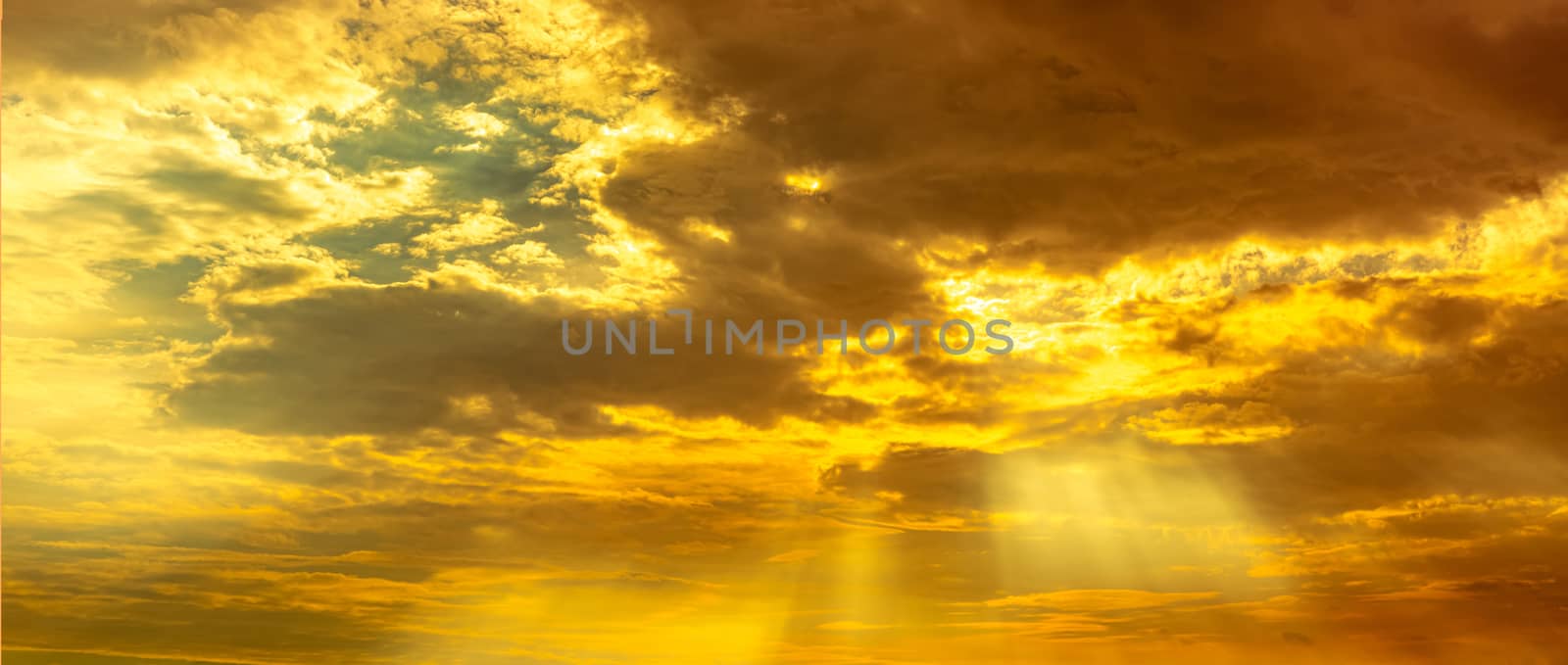 God light. Dramatic golden cloudy sky with sun beam. Yellow sun  by Fahroni