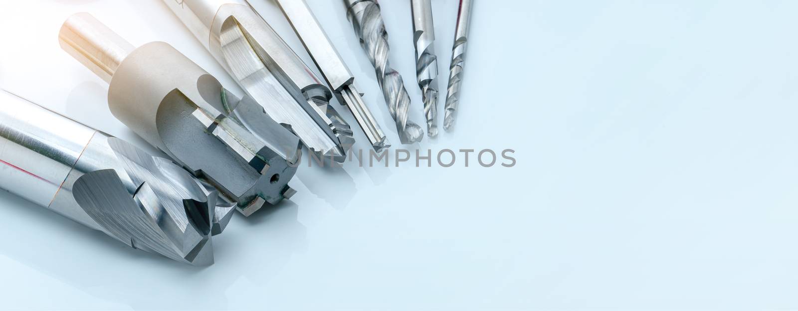 Special tools isolated on white background. Made to order special tools. Coated step drill and reamer detail. HSS cemented carbide. Carbide cutting tool for industrial applications. Engineering tools.