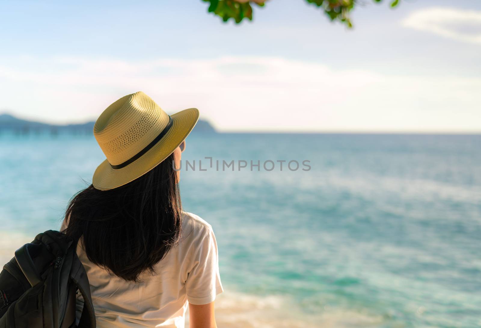 Back view of happy young Asian woman in casual style fashion wit by Fahroni