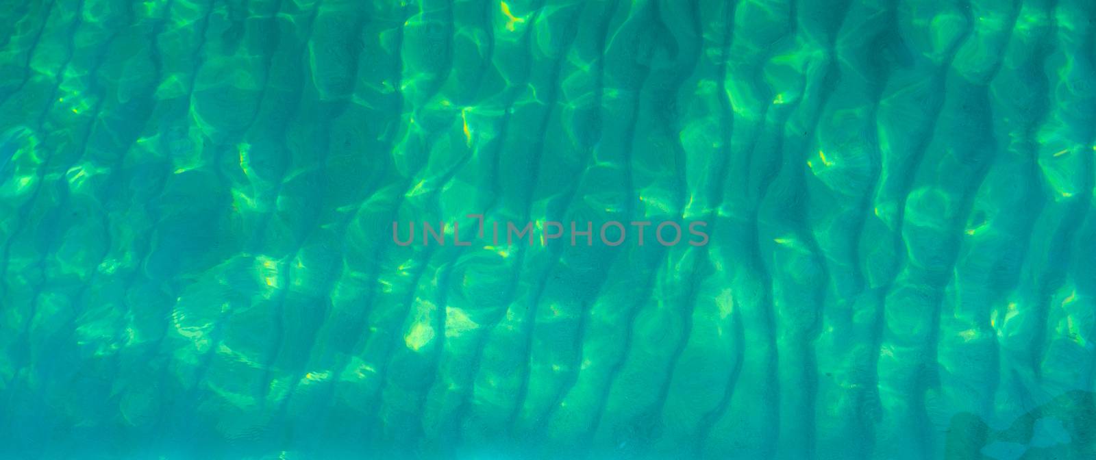 Green abstract texture background of emerald green sea water. To by Fahroni