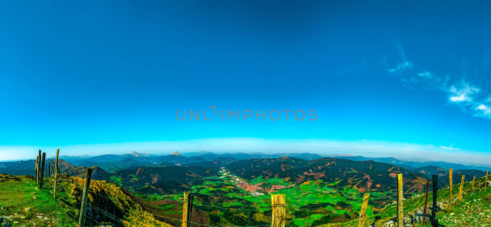 Landscape of mountain and village in valley. View from top of mo by Fahroni