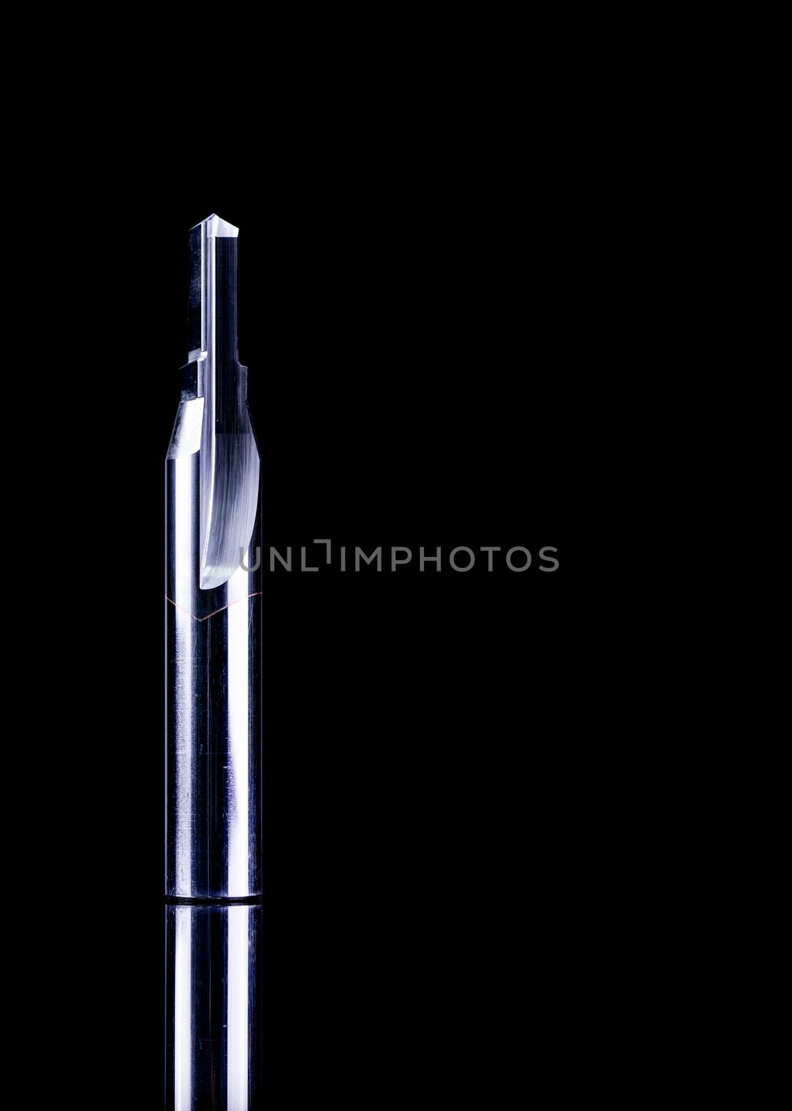 Special tools isolated on black texture background. Made to order special tools. Sharp reamer detail. HSS cemented carbide. Carbide cutting tool for industrial applications. Engineering tools on dark.