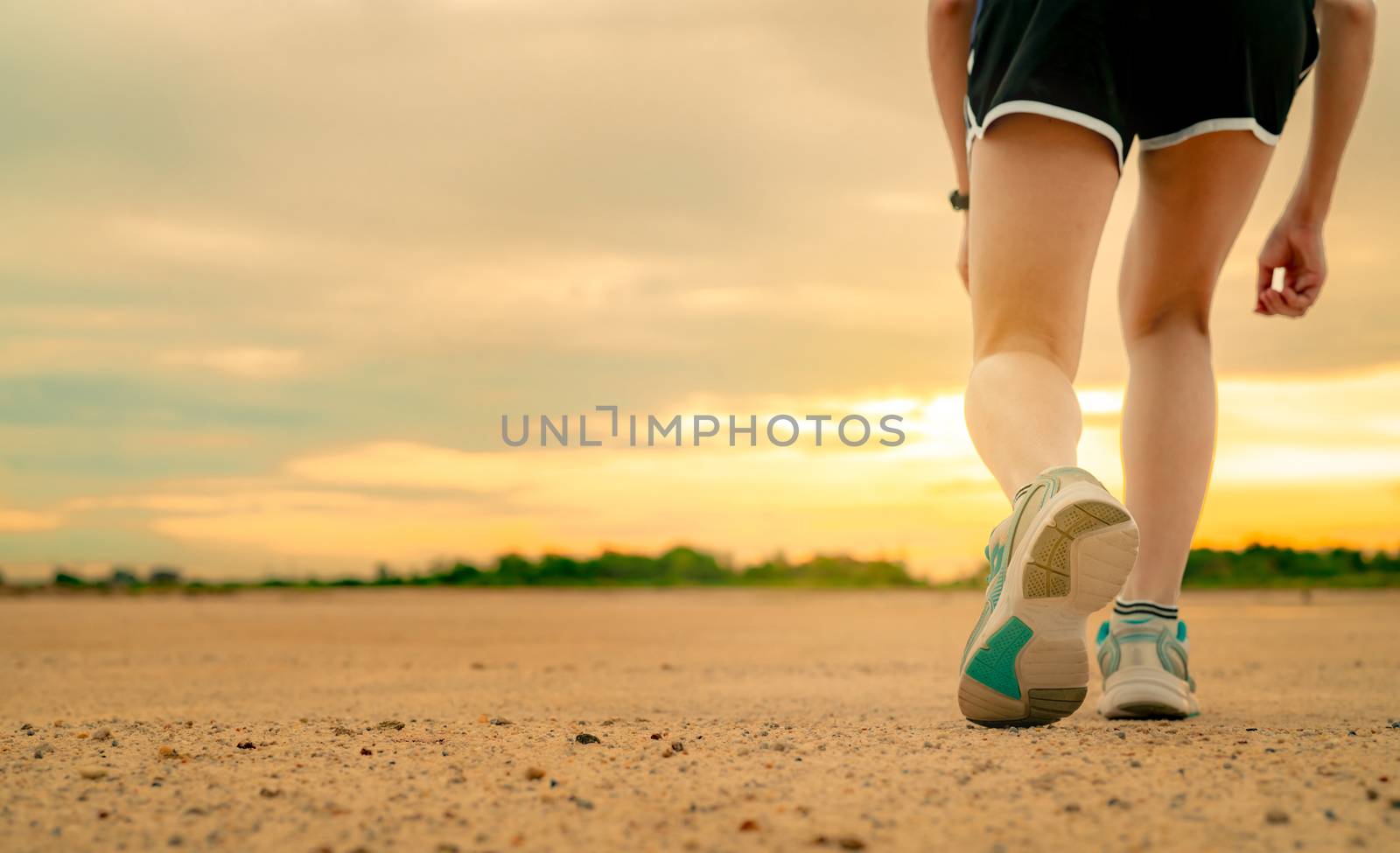 Athlete woman runner getting ready for start training run at the by Fahroni