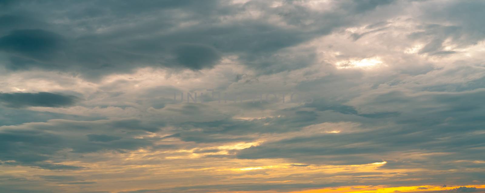 Morning sunrise sky and white clouds. Beautiful golden sunrise sky with white fluffy clouds. White fluffy cloudscape abstract background. Beauty in nature. Dramatic heaven sky. Art picture background