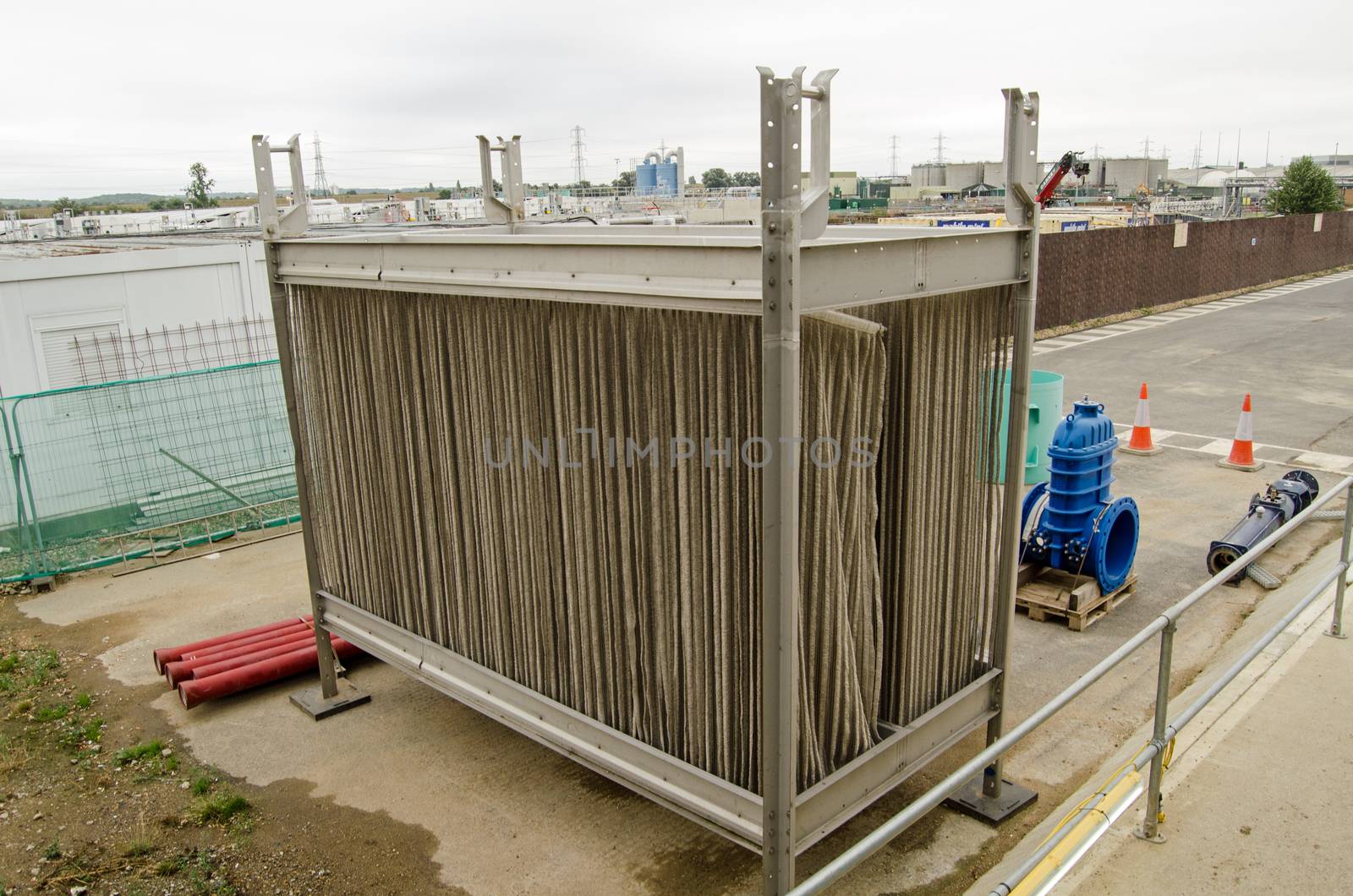 LONDON, UK - SEPTEMBER 17, 2016:  View of a metal cage strung with curtains of plastic beads.  The beads are covered in activated bacteria to help clean sewage passing through the cage. Deephams Sewage Treatment Works, Edmonton, North London.