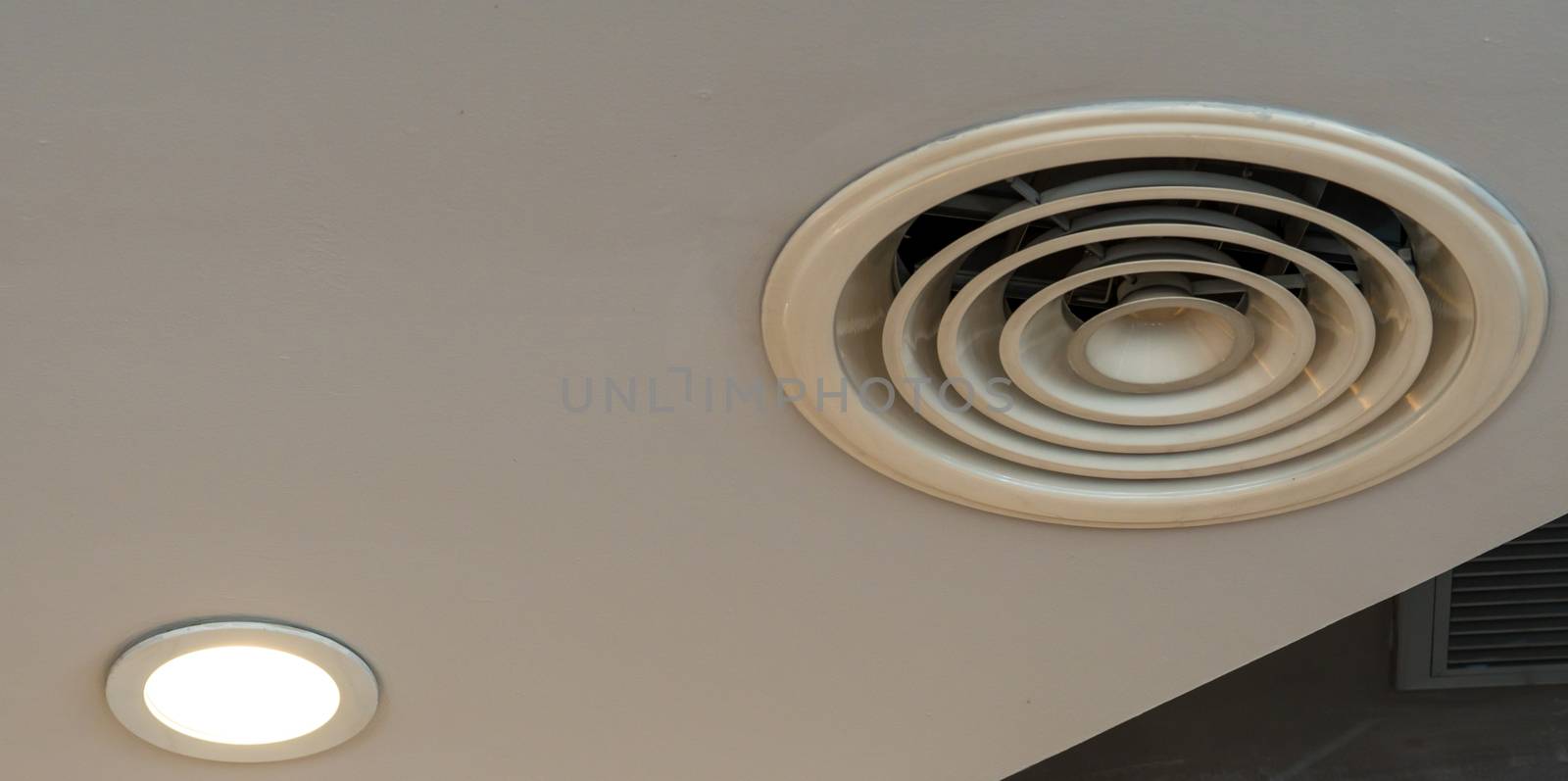 Air duct on ceiling in the mall or hospital. Air conditioner ins by Fahroni