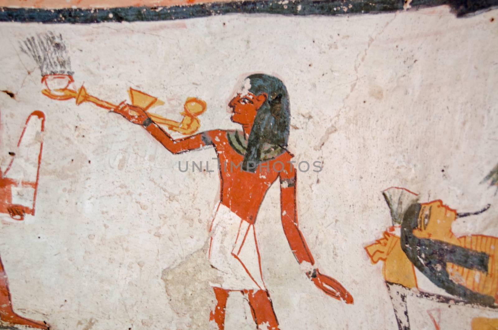 Ancient Egyptian mural showing a priest carrying an incense burner over a mummy.  Ancient Egyptian tomb of Amenemonet on the West Bank of the Nile at Luxor, Egypt.  Historic painting, thousands of years old.