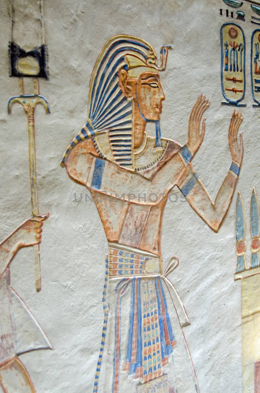 Painting on the wall of an Ancient Egyptian tomb showing the Pharaoh Ramses III praising the gods.  Tomb of Amunherkhopshef in the Valley of the Queens, thousands of years old.