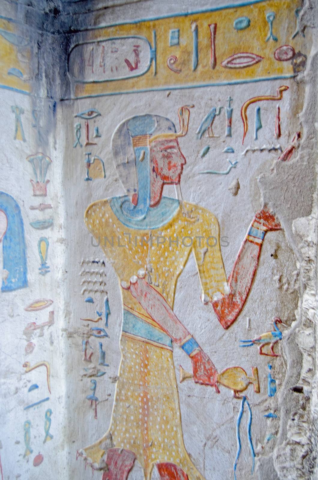 Ancient Egyptian painting on the wall of the tomb of Prince Titi wearing the skin of a leopard.  Ancient Egyptian tomb in the Valley of the Queens on the West Bank of the Nile at Luxor, Egypt.  Thousands of years old.