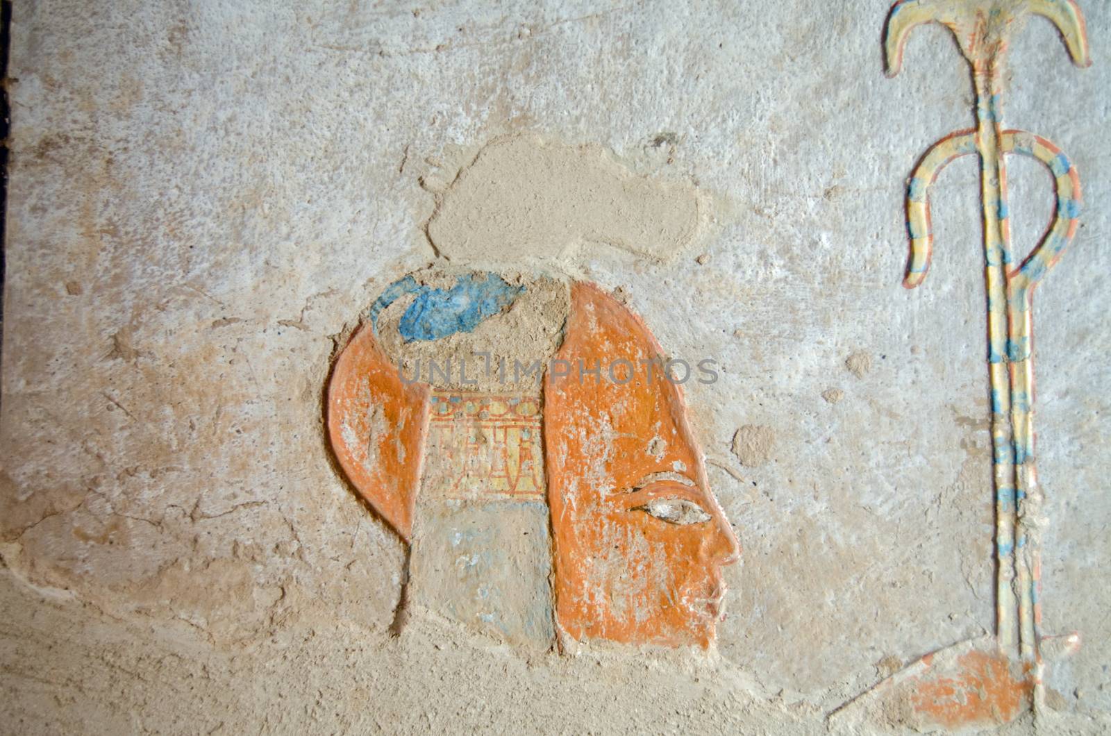 Remnent of the colourful carving of the Ancient Egyptian Prince Khaemwaset on the wall of his tomb in the Valley of the Queens, Luxor, Egypt.  The tomb was built thousands of years ago and is now open to the public.