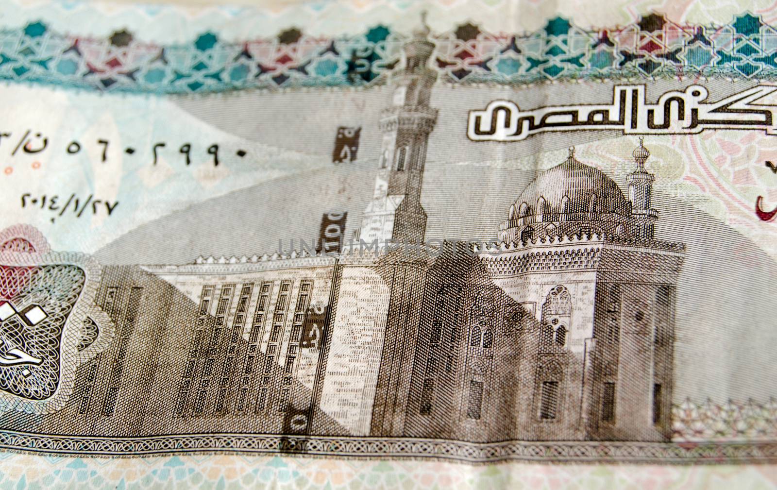 Detail of the Sultan Hassan Mosque in Cairo as depicted on the 100 Egyptian Pound banknote.  Used banknote, photographed at an angle.  