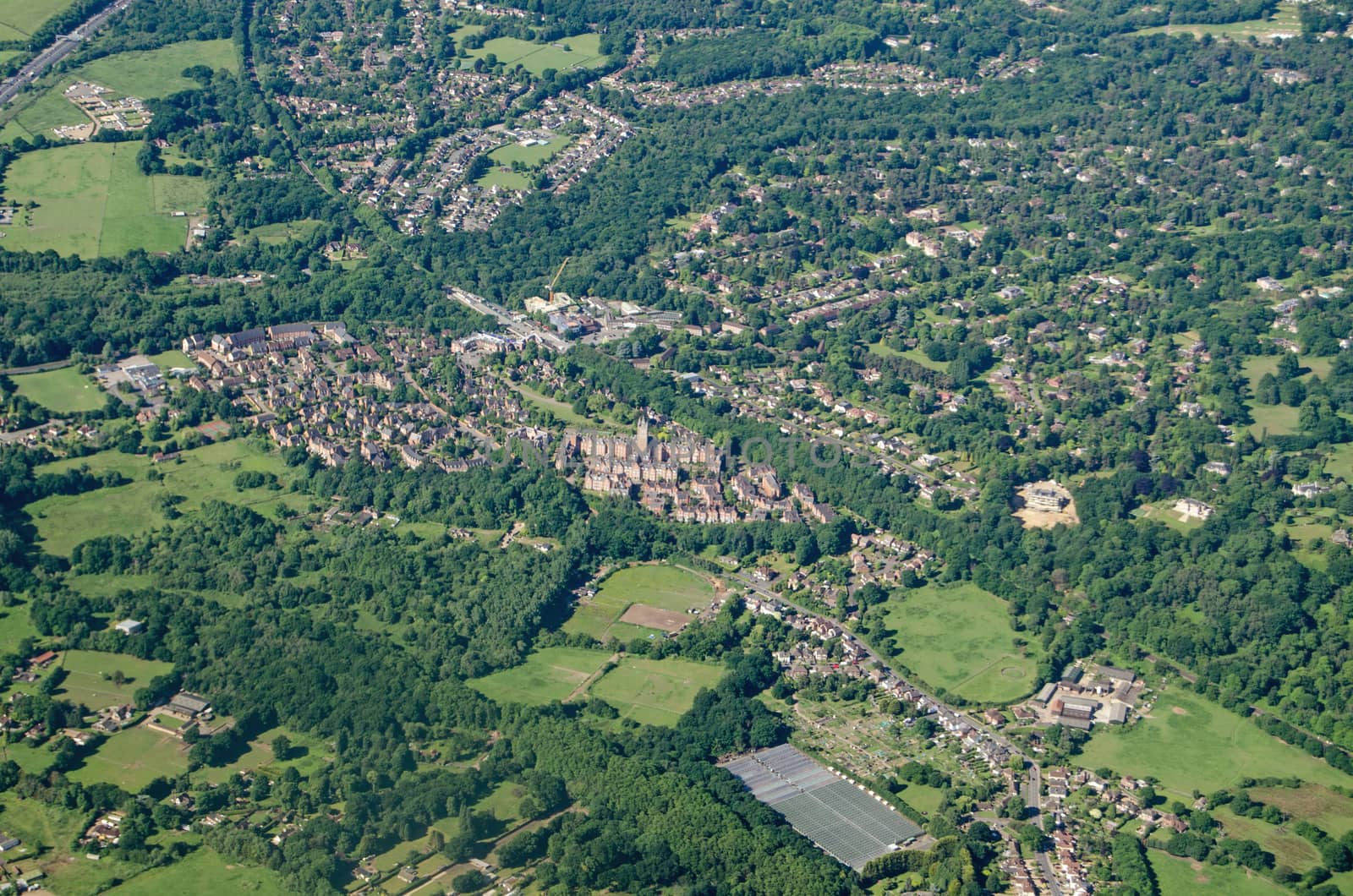 View from a plane of the Surrey town Virginia Water, a wealthy residential area.  The landmark Victorian Gothic former Holloway Sanatorium is towards the middle of the image, it has been converted to a high class residential development.