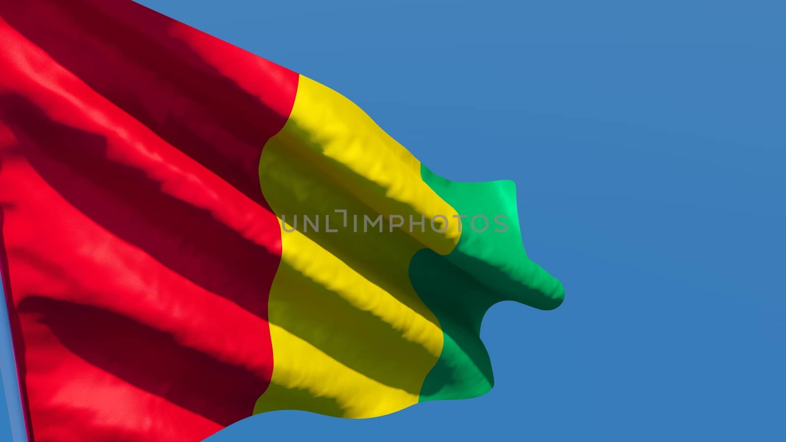 3D rendering of the national flag of Guinea waving in the wind against a blue sky