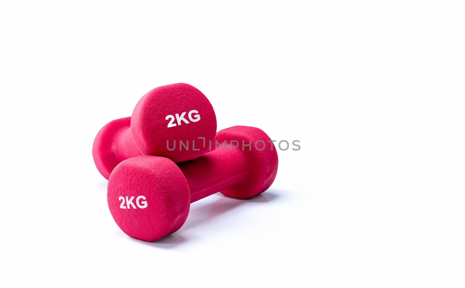 Set of red dumbbells isolated on white background. A pair of red neoprene dumbbells. Home gym equipment for exercise at home. Weight training equipment for sculpt arms, shoulders, back, and legs.