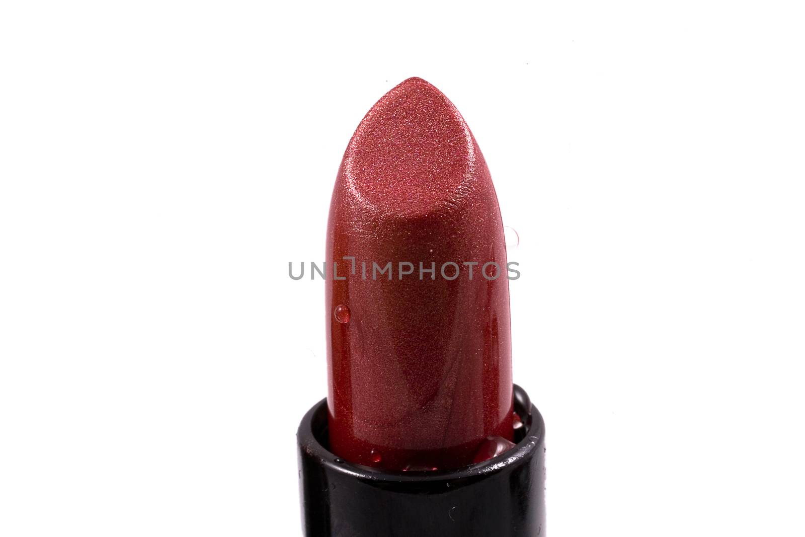 red lipstick in a black body on a white isolated background by Lukrecja