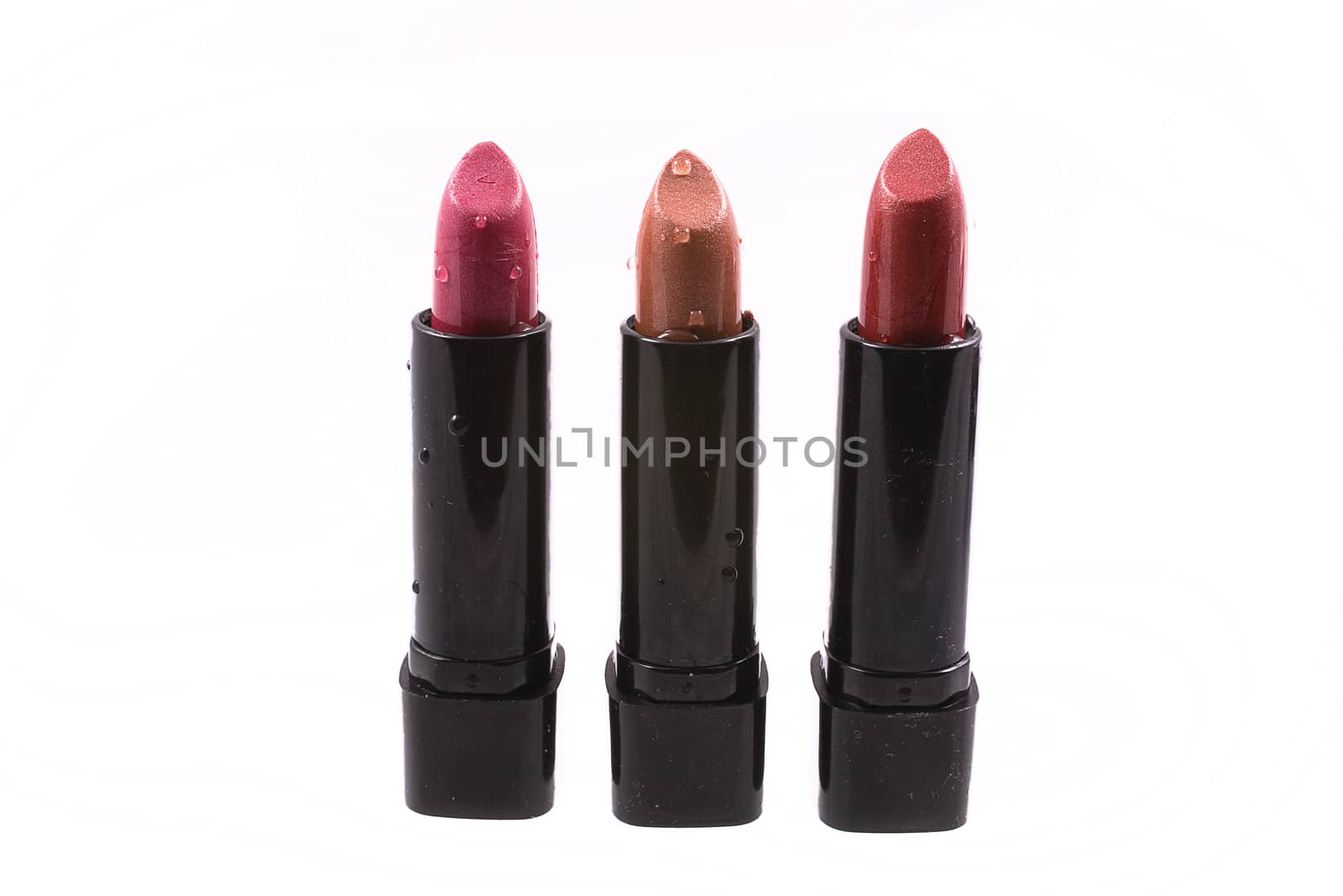 beautiful red lipstick in a black body on a white isolated background