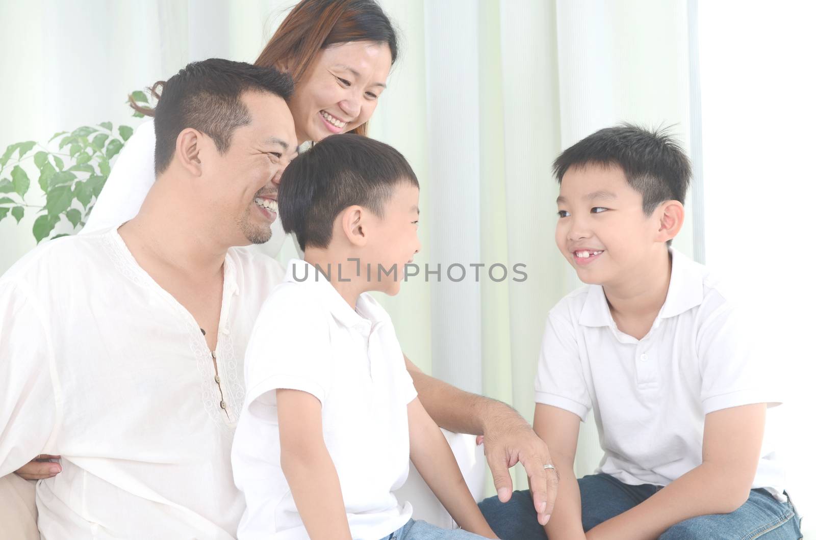 happy asian family parent spending time with their children during coronavirus pandemic time.