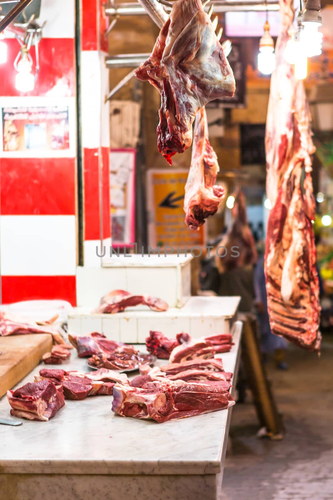 Arabian butcher shop with chickens and hanging meat