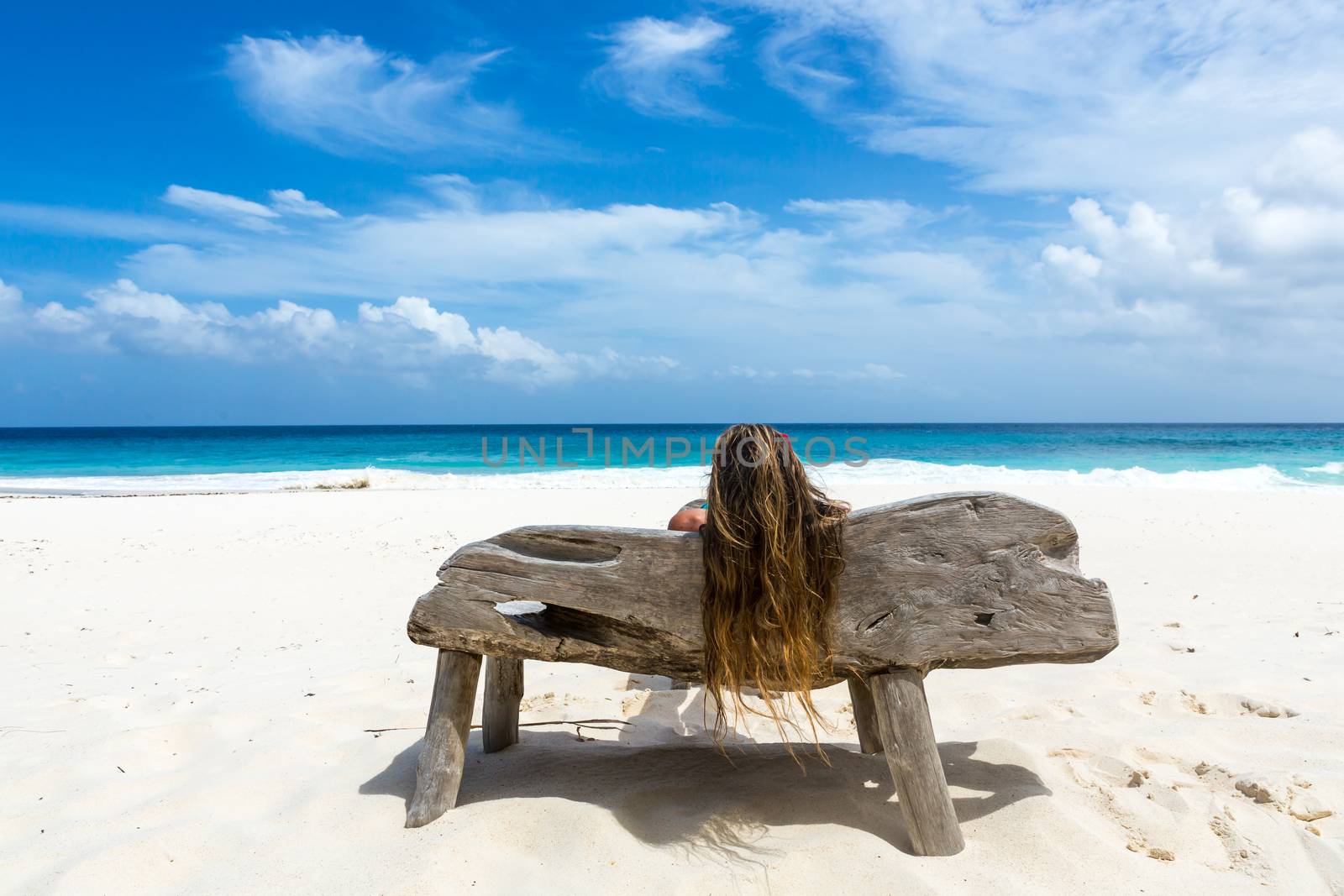 Paradise beach of Seychelles. view of woman's back admiring the sea. by SeuMelhorClick