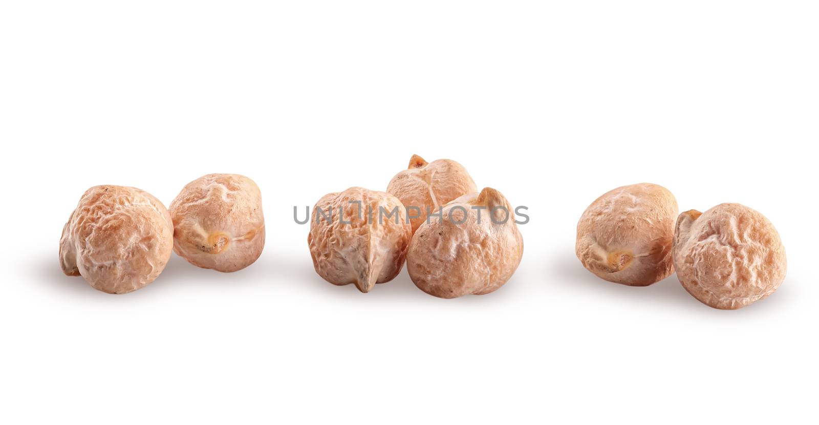 Several whole dry chickpeas in a row isolated on white background