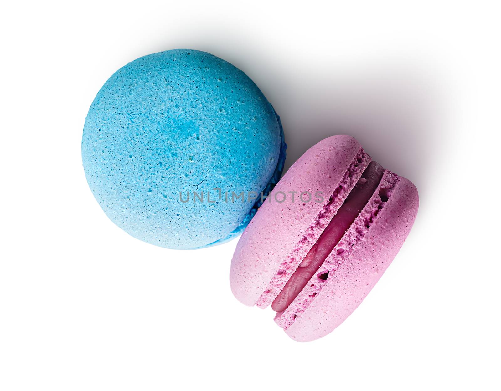 Two macaroon blue pink top view on white background