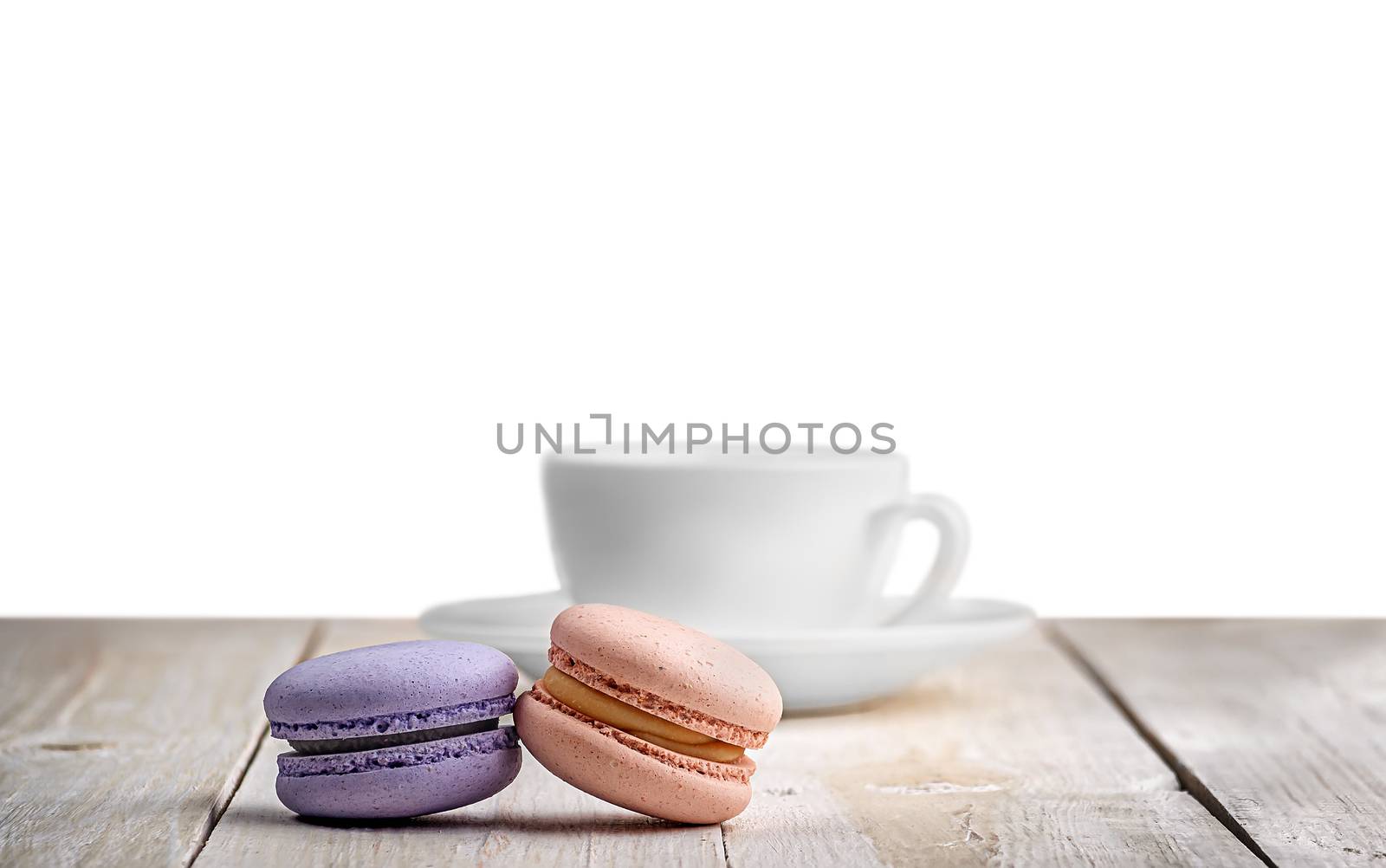 Two macaroons with a cup coffee by Cipariss
