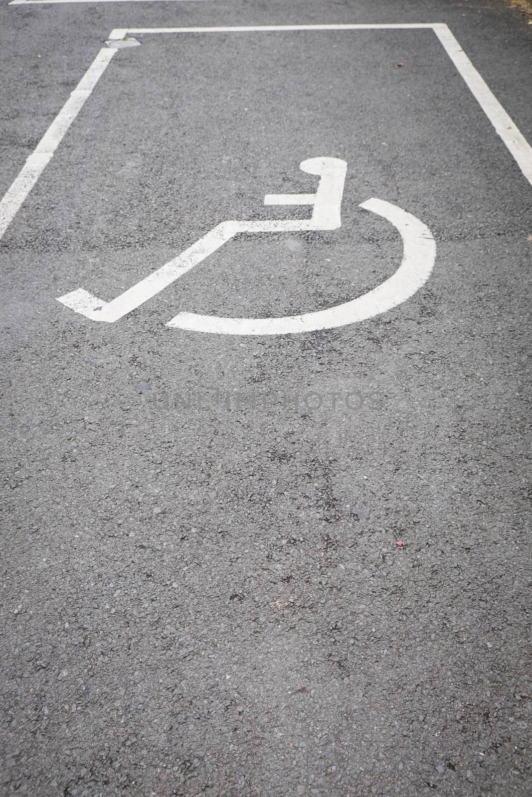 A sign on the pavement - disabled car parking by paddythegolfer