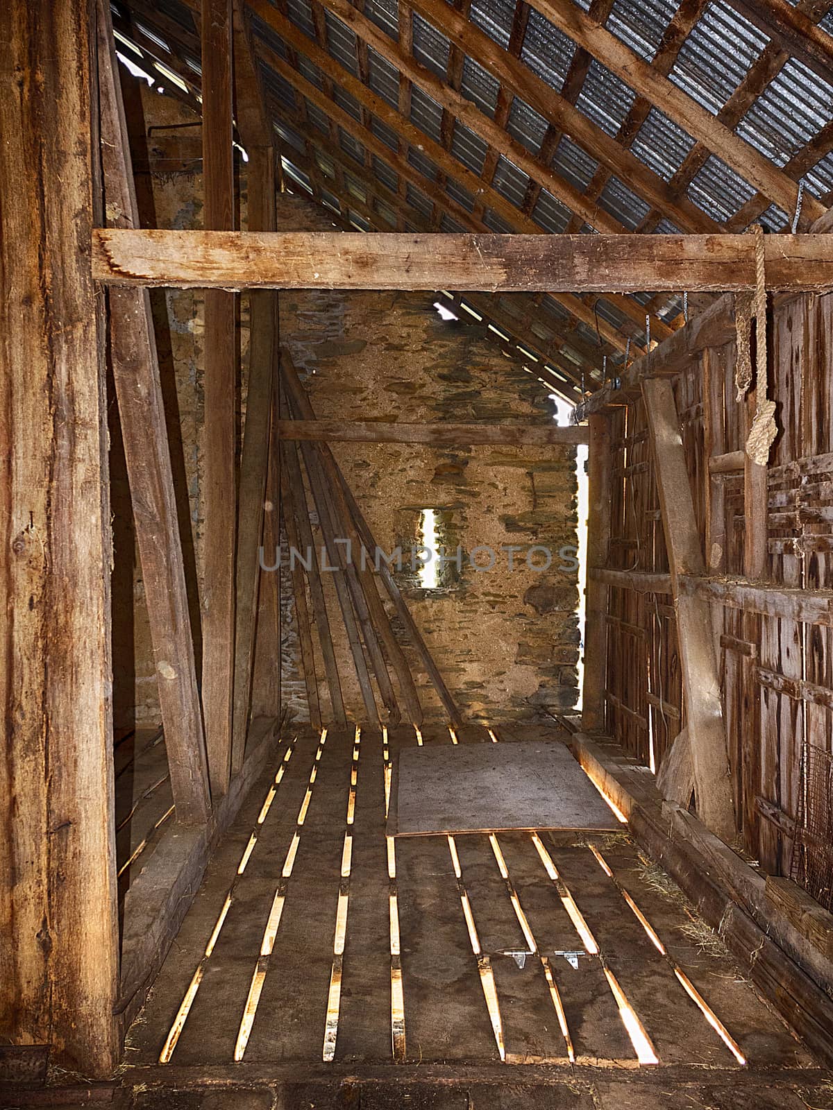 Interior view of old bank barn with stone walls