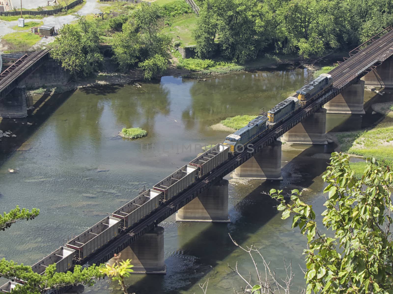 Empty coal cars crossing railroad bridge over Potomac River