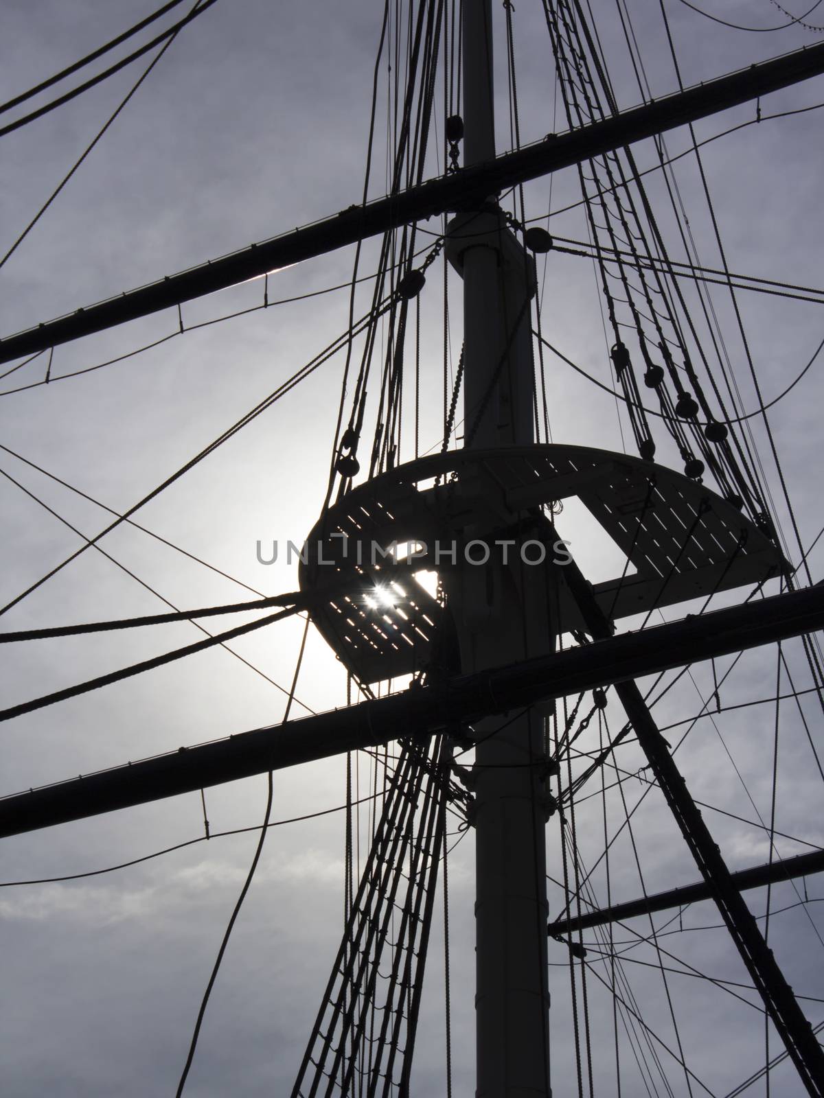 Sailing ship rigging backlit by sun by CharlieFloyd