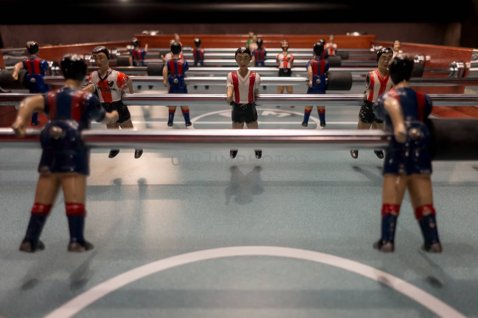 foosball players pieces in very close view by jmagfoto