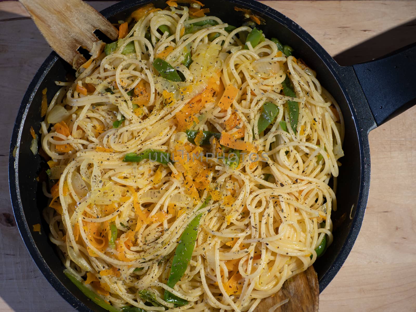 noodles with vegetables in a pan