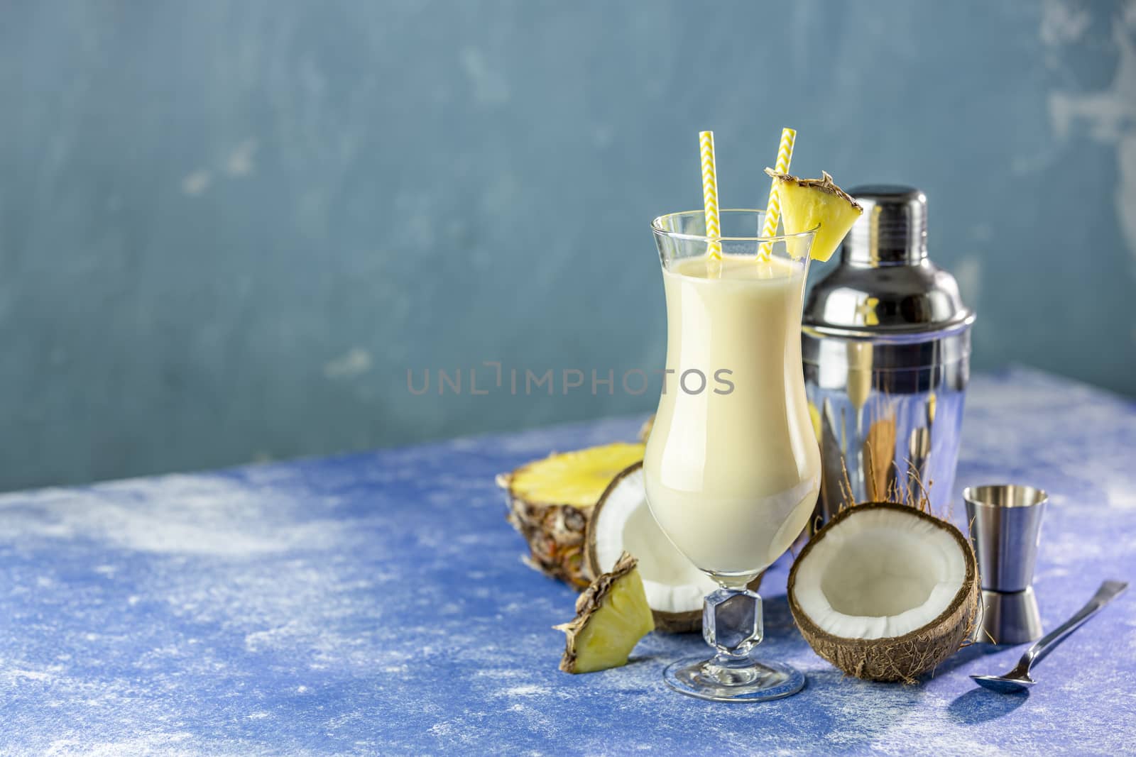Glass of tasty Frozen Pina Colada Traditional Caribbean cocktail by ArtSvitlyna