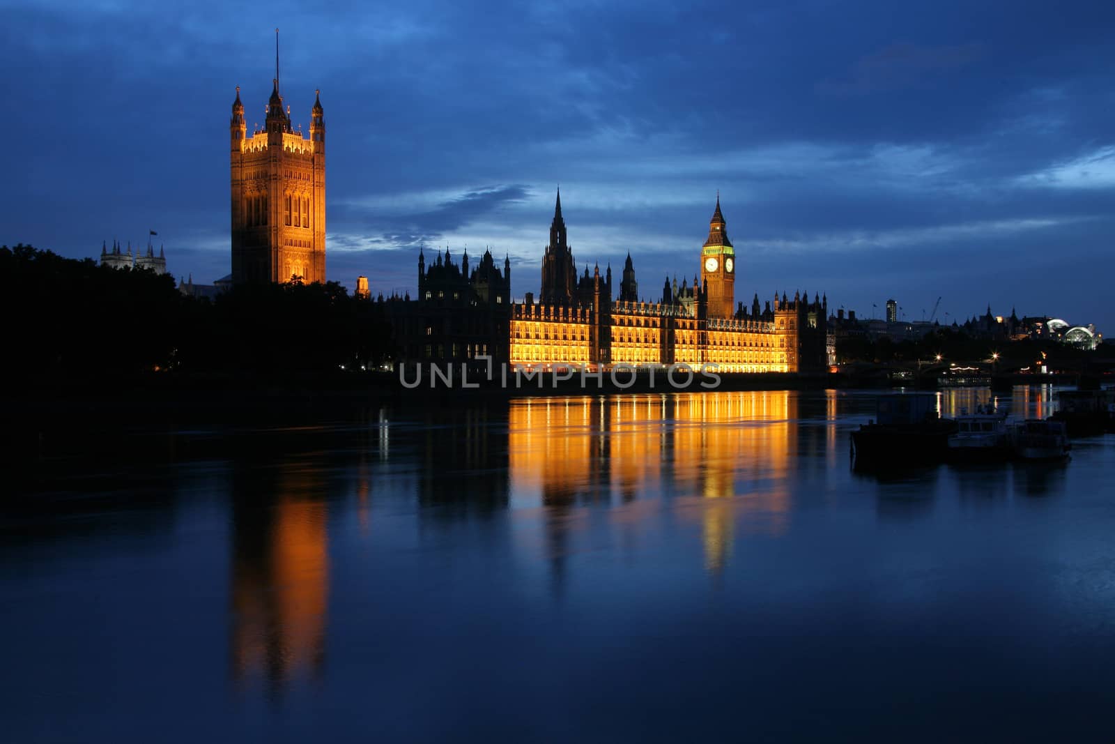 Dusk view of the Houses of Parliament and the River Thames
