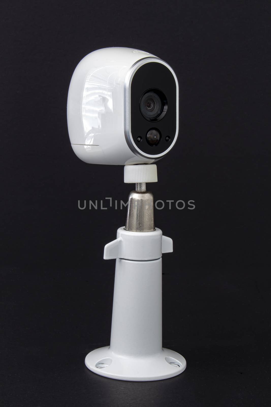 An Arlo security camera on black background by oasisamuel