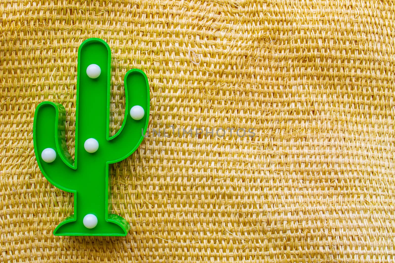 Cinco de Mayo background. A cactus on a straw rural bag background texture by oasisamuel
