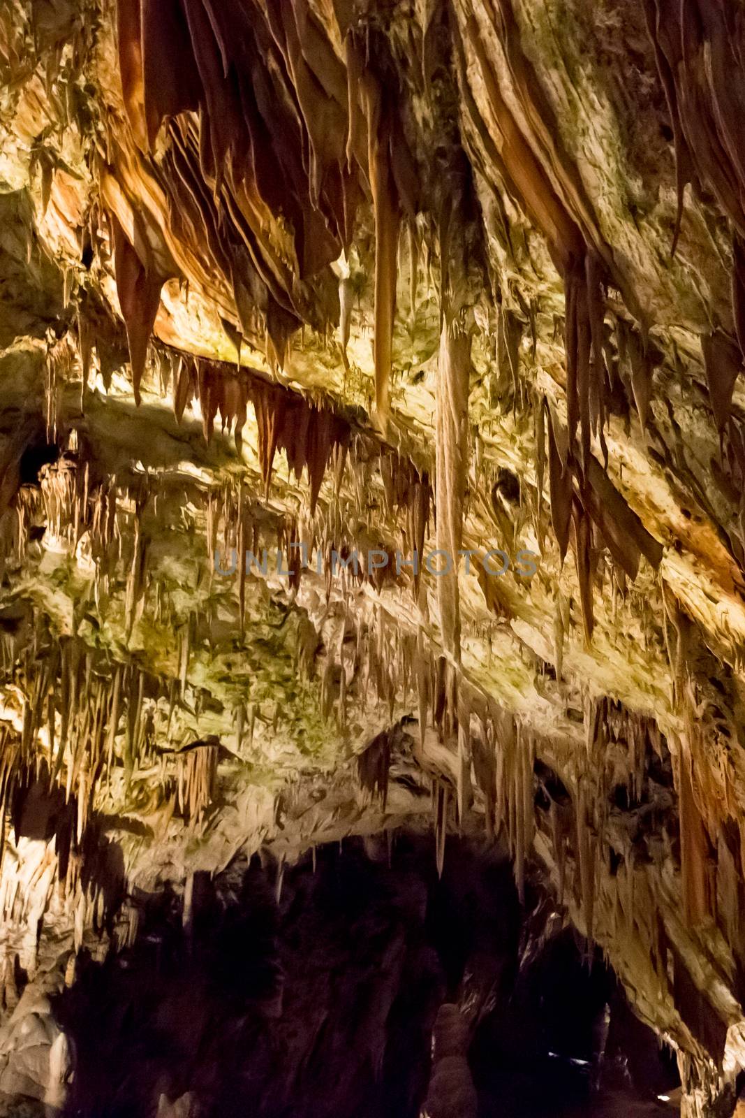 Postojna cave, Slovenia. Formations inside cave with stalactites and stalagmites by SeuMelhorClick