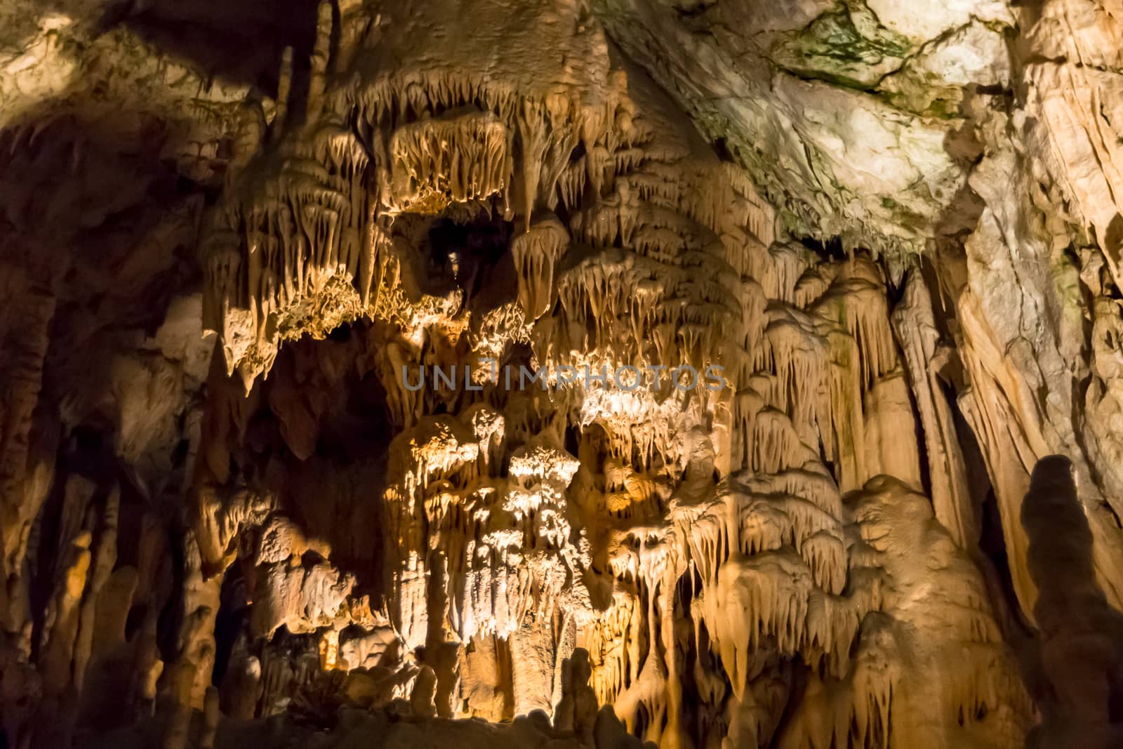 Postojna cave, Slovenia. Formations inside cave with stalactites and stalagmites by SeuMelhorClick