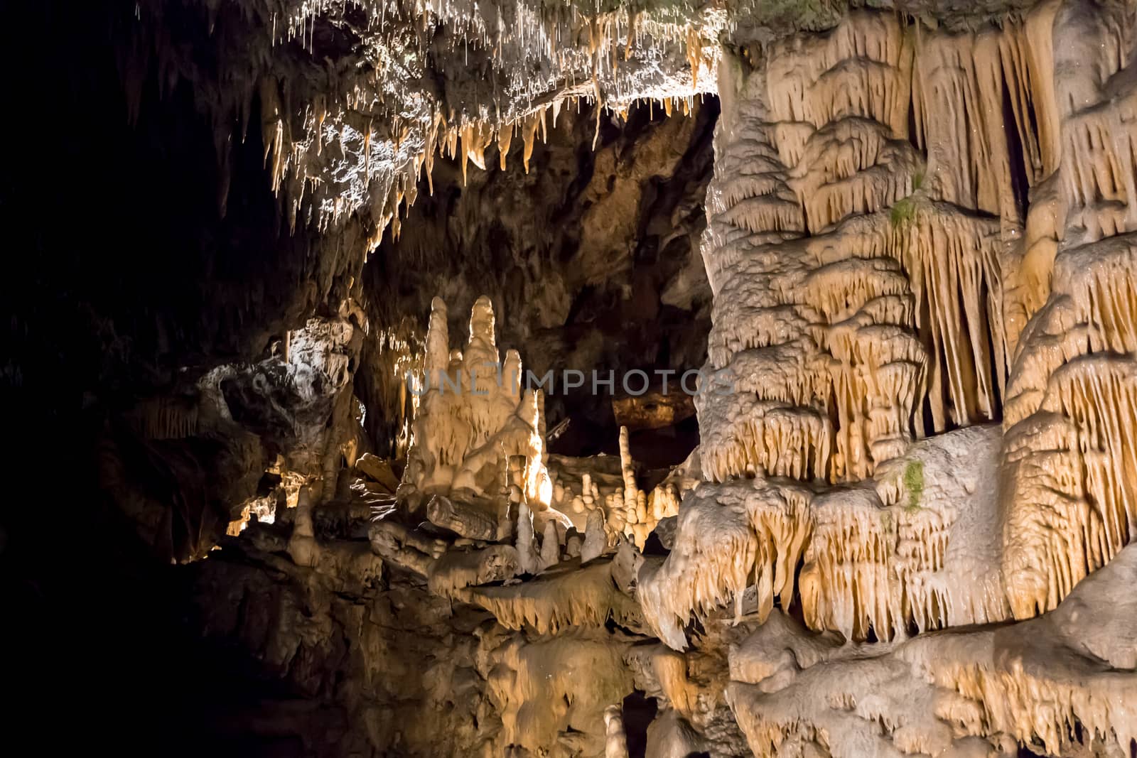 Postojna cave, Slovenia. Formations inside cave with stalactites and stalagmites by SeuMelhorClick