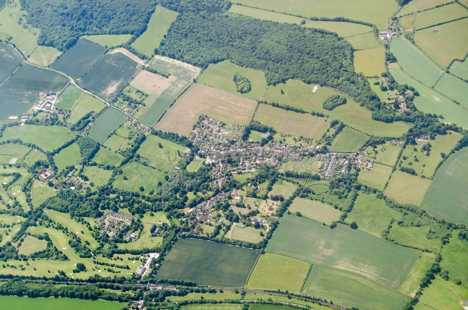Aerial view of the Kent village of Shoreham on a sunny summer day.  Note the white cross cut into the chalk downs which is a memorial to those killed in World War I.  