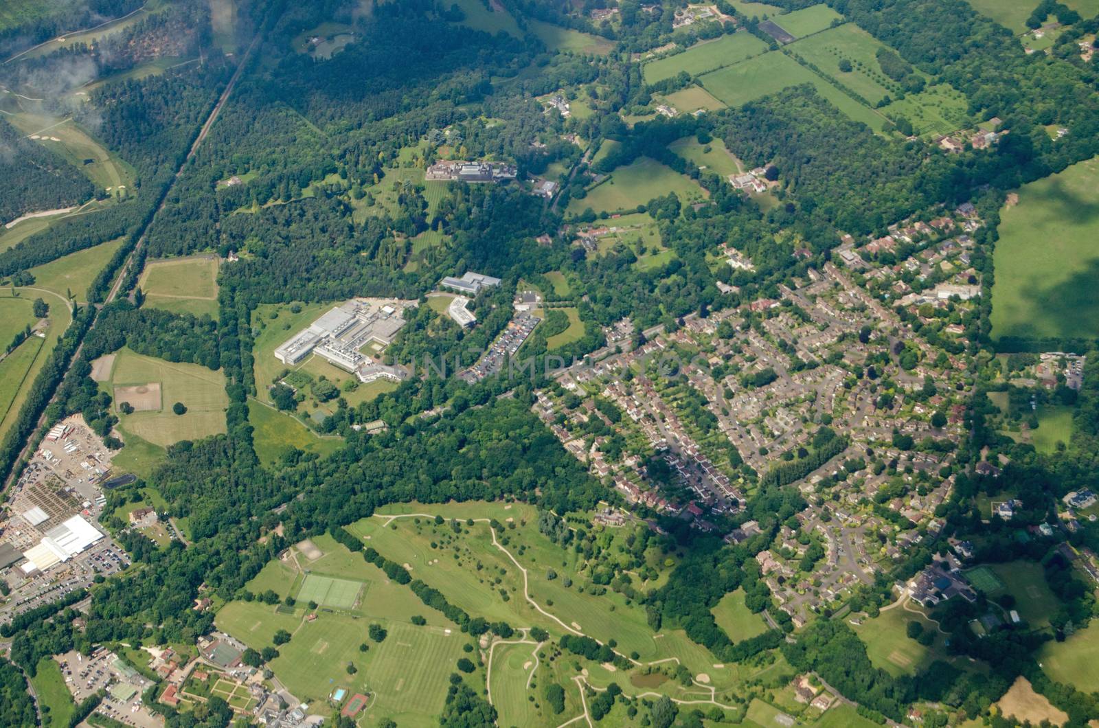 Aerial view of part of the Surrey village of Windlesham.  Together with housing and a golf course, the research and development site of the pharmaceutical company Eli Lilly is visible in the centre of the image.  