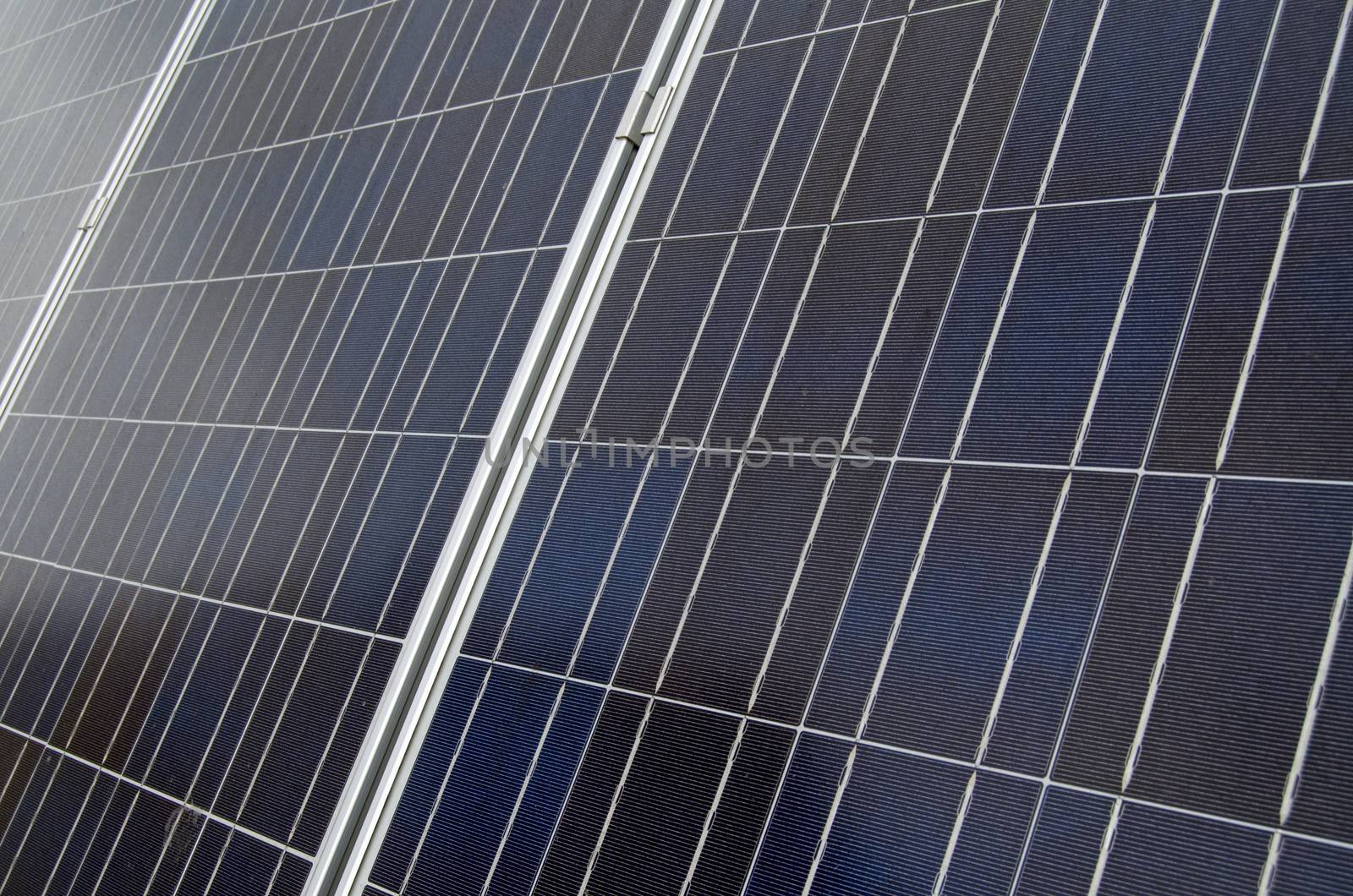 Detail of solar panels soaking up the sun's rays on a roof in London.