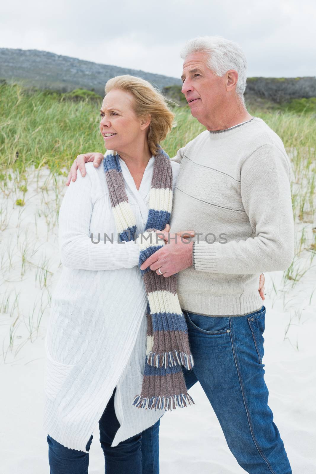 Relaxed romantic senior man and woman at the beach