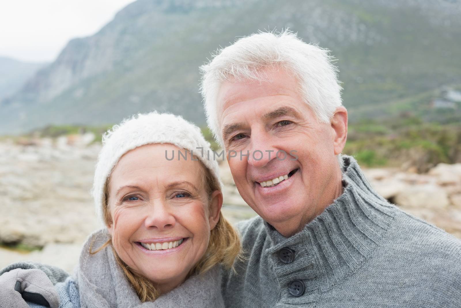 Closeup portrait of a romantic senior couple together on a rocky landscape