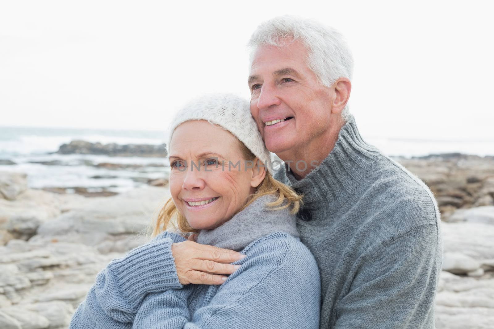 Closeup of a romantic senior couple together on a rocky beach