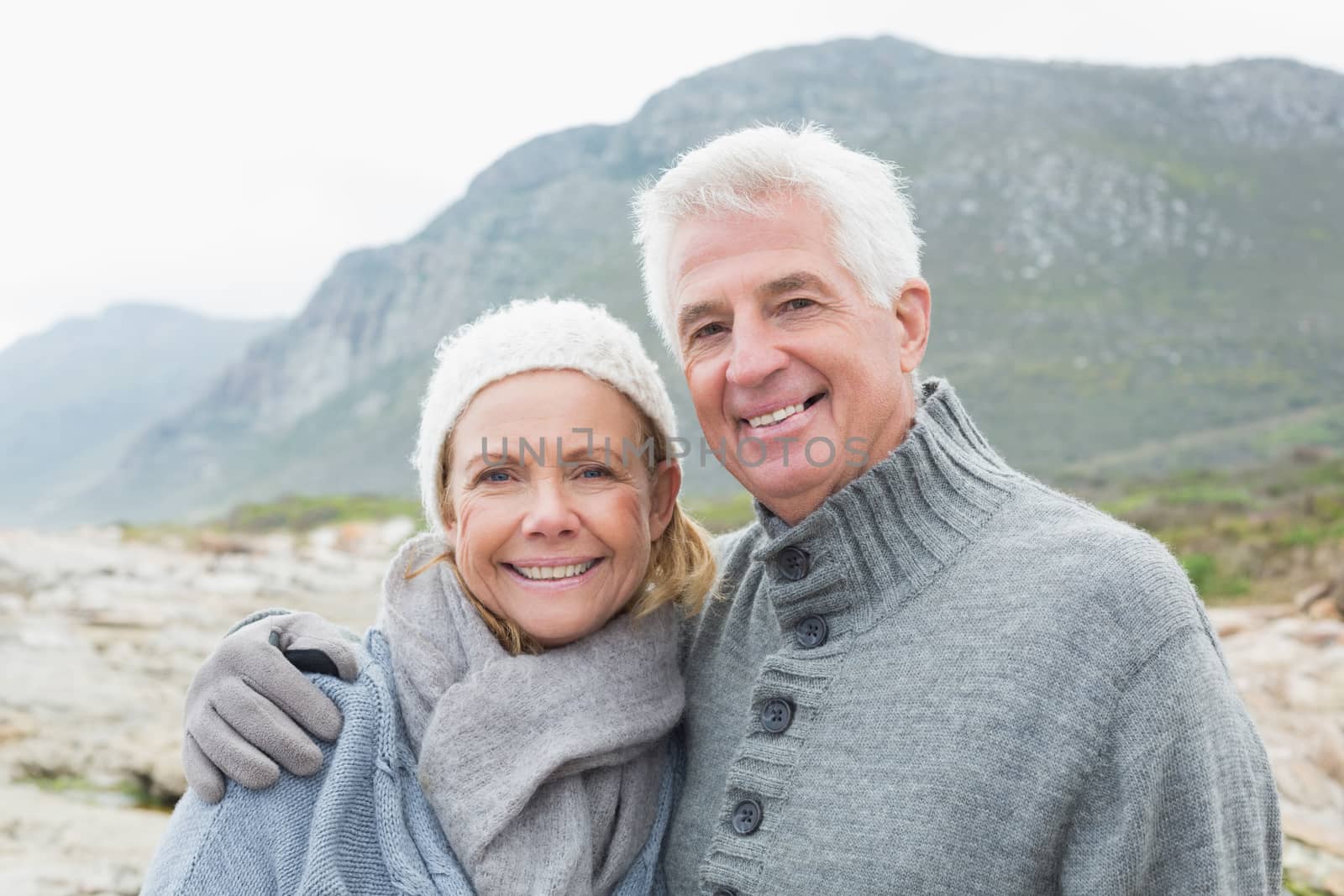 Portrait of a romantic senior couple together on a rocky landscape
