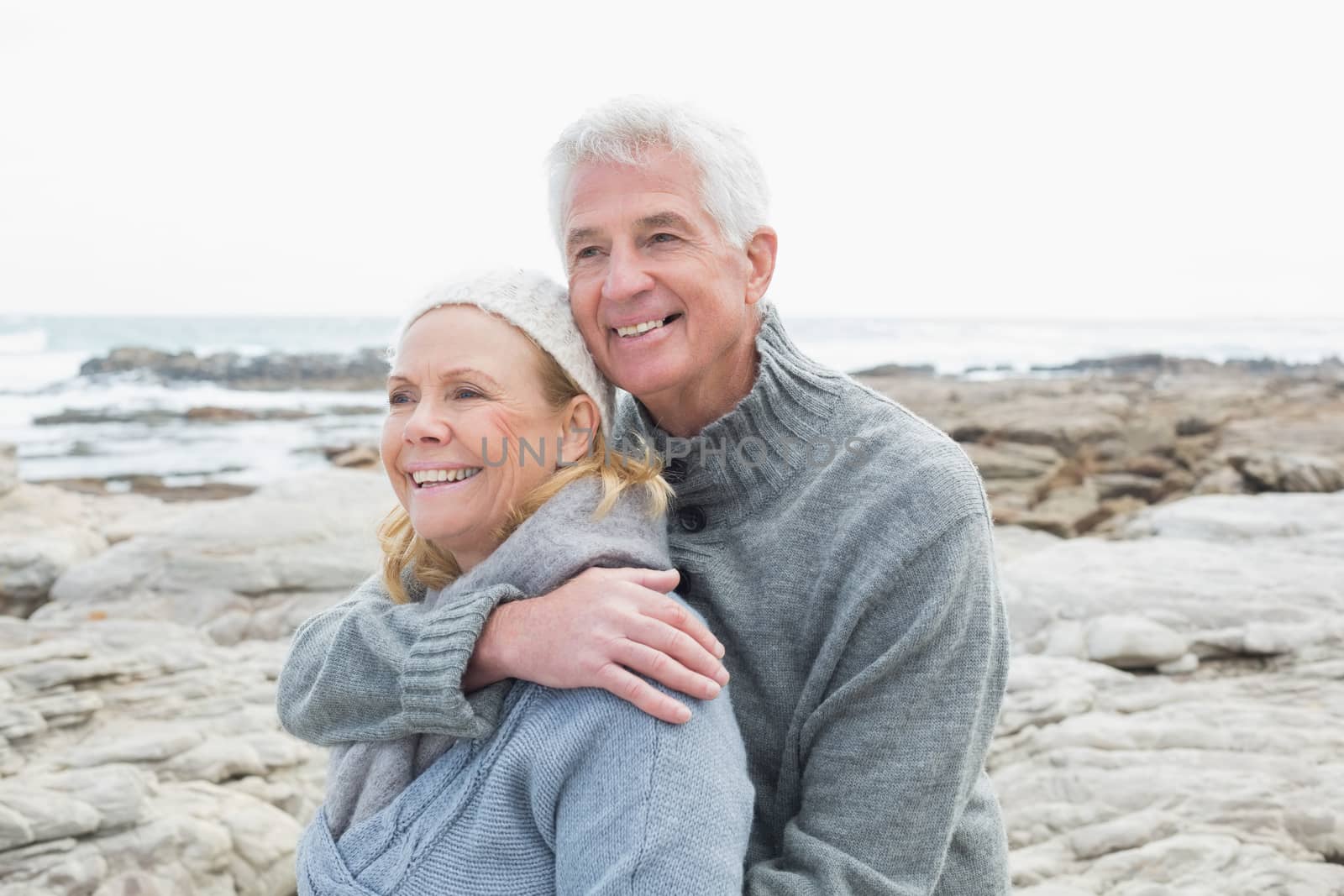 Closeup of a romantic senior couple together on a rocky beach